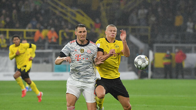 Niklas Süle (l.) im Zweikampf mit Erling Haaland. Niklas Süle (l.) im Zweikampf mit Erling Haaland.
