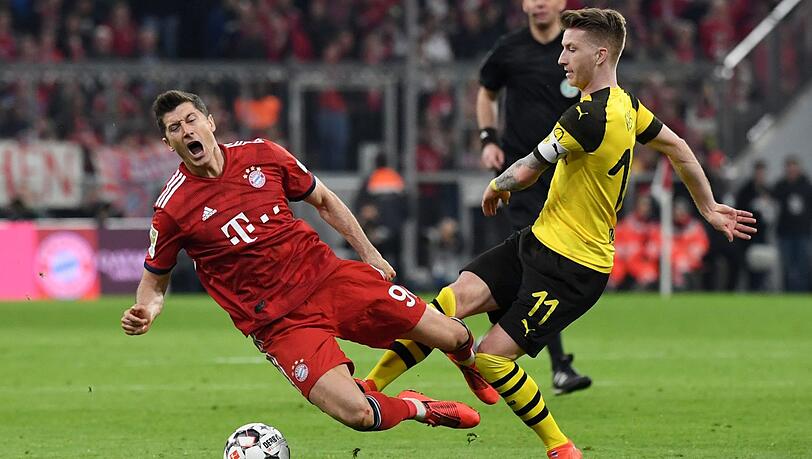 Zweikampf um den Titel? Dortmund mit Marco Reus (r.) gegen den FC Bayern um Robert Lewandowski. Zweikampf um den Titel? Dortmund mit Marco Reus (r.) gegen den FC Bayern um Robert Lewandowski.