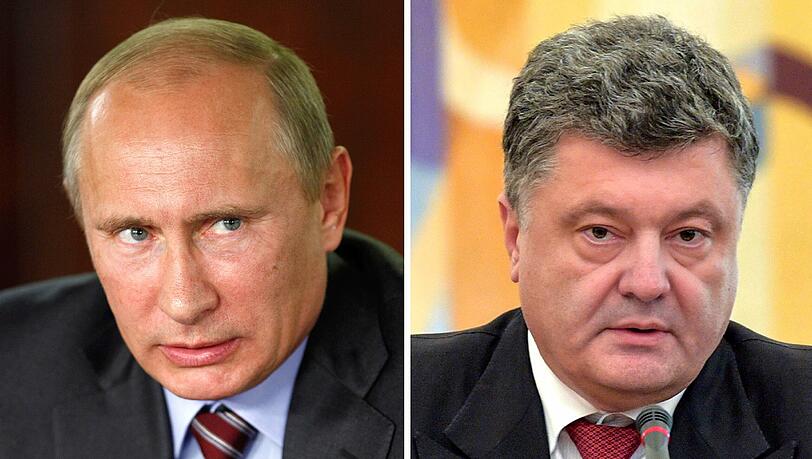 Der ukrainische Präsident Petro Poroschenko (r.) ordnete am Samstag an, die Finanzierung von Staatsbetrieben und Behörden in dem Bürgerkriegsgebiet zu stoppen sowie Mitarbeiter in andere Landesteile zu verlegen. Kremlchef Wladimir Putin ist empört.