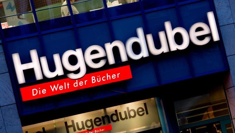 Der Schriftzug "Hugendubel - Die Welt der Bücher" ist an einer Filiale des Buchhändlers in München zu sehen. Foto: Sven Hoppe/Archiv Der Schriftzug "Hugendubel - Die Welt der Bücher" ist an einer Filiale des Buchhändlers in München zu sehen. Foto: Sven Hoppe/Archiv