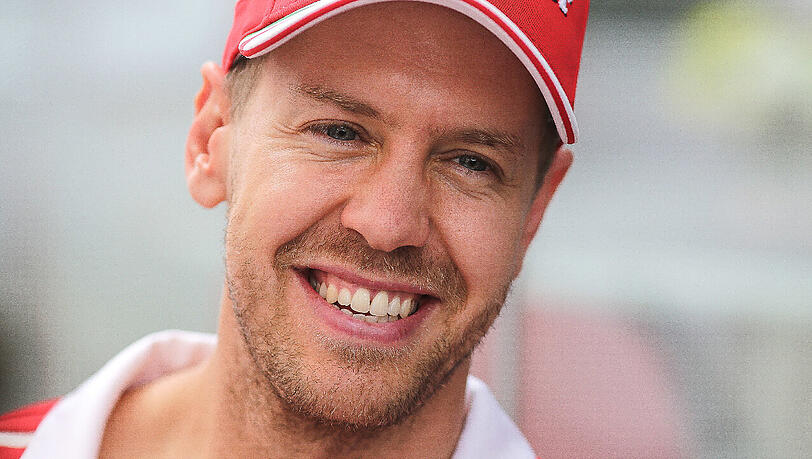 Kann schon wieder lachen: WM-Verlierer Sebastian Vettel. Kann schon wieder lachen: WM-Verlierer Sebastian Vettel.
